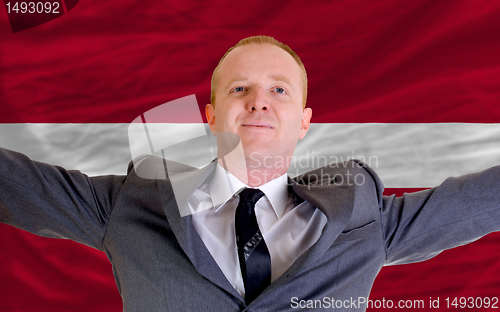 Image of happy businessman because of profitable investment in latvia sta