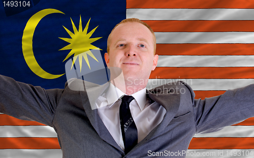 Image of happy businessman because of profitable investment in malaysia s