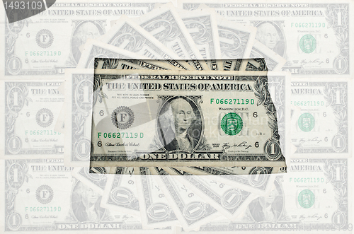 Image of Outline map of north dakota with transparent american dollar ban