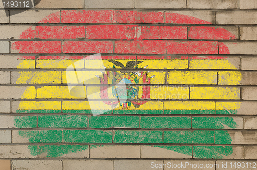 Image of flag of bolivia on grunge brick wall painted with chalk  