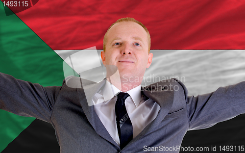 Image of happy businessman because of profitable investment in sudan stan