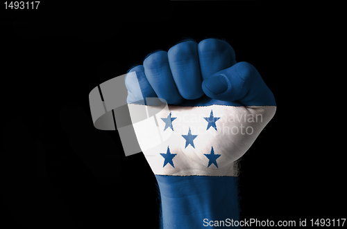 Image of Fist painted in colors of honduras flag