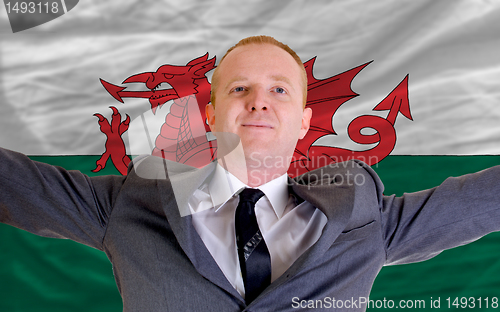 Image of happy businessman because of profitable investment in wales stan