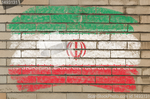 Image of flag of iran on grunge brick wall painted with chalk  