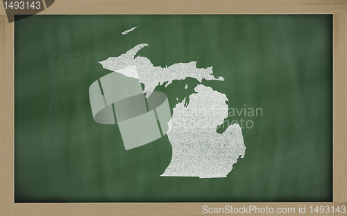 Image of outline map of michigan on blackboard 