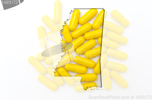 Image of Outline map of mississippi with transparent pills in the backgro