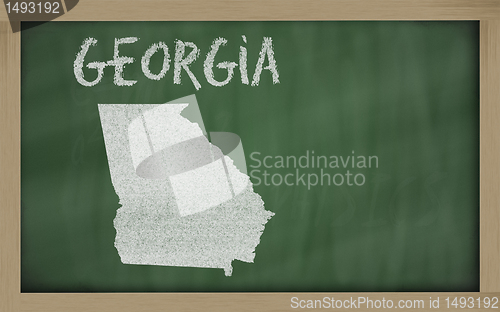 Image of outline map of georgia on blackboard 