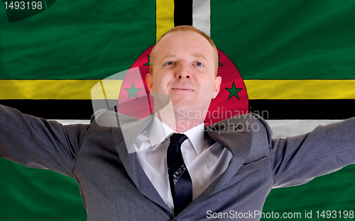 Image of happy businessman because of profitable investment in dominica s