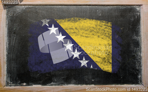 Image of flag of bosnia and herzegovina on blackboard painted with chalk 