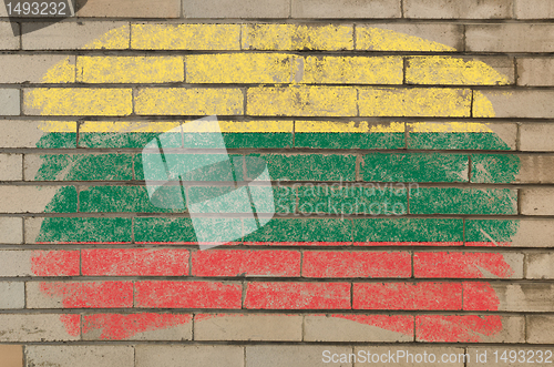 Image of flag of lithuania on grunge brick wall painted with chalk  