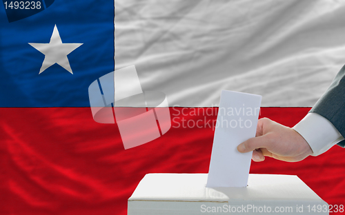 Image of man voting on elections in chile