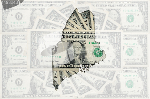 Image of Outline map of maine with transparent american dollar banknotes 