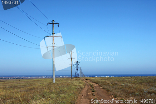 Image of row of electricity pillons