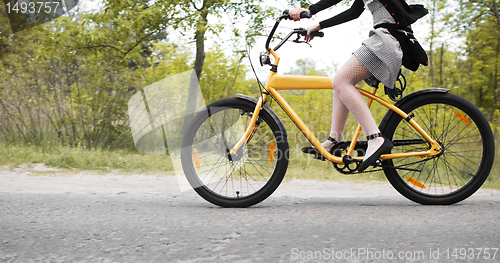 Image of young girl cycling on custom bike