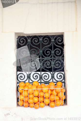 Image of Old Tunisian window with oranges