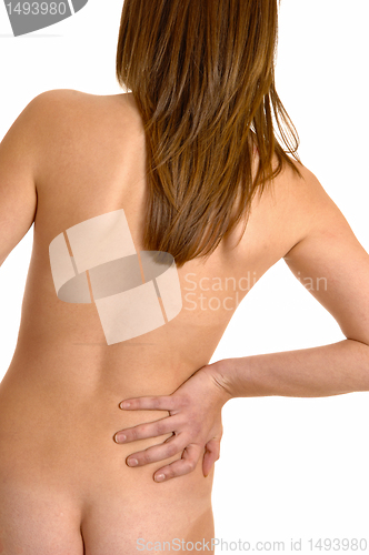 Image of Nude woman with back pain.