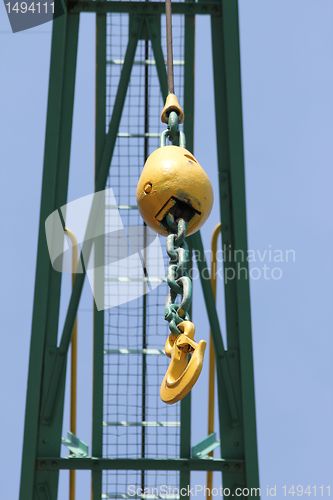Image of old yellow crane hook