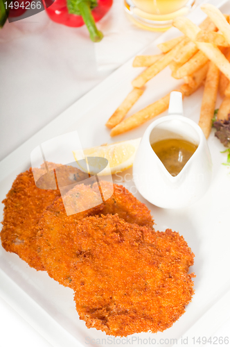 Image of classic Milanese veal cutlets and vegetables