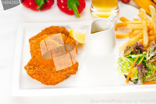 Image of classic Milanese veal cutlets and vegetables