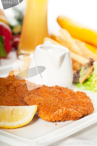 Image of classic Milanese veal cutlets and vegetables