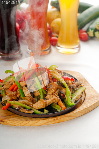 Image of original fajita sizzling hot  on iron plate