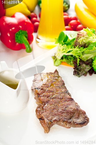 Image of juicy BBQ grilled rib eye ,ribeye steak and vegetables