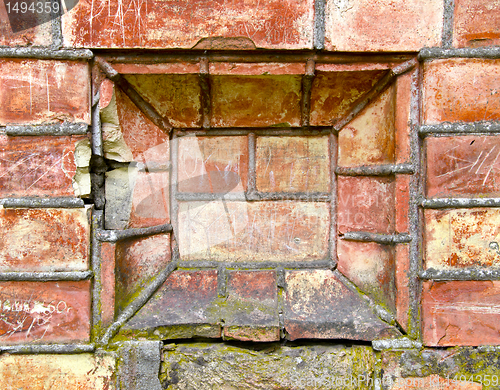 Image of Old ancient gate made of red brick background.