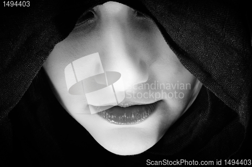 Image of Woman with black hood, focus on her lips