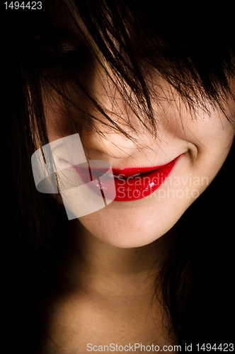 Image of Closeup photo of a girl with a grin on her face