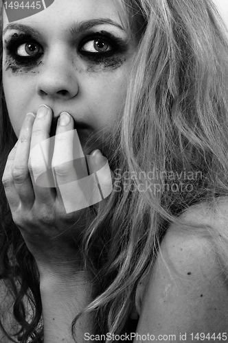 Image of Scared girl with beautiful blond hair
