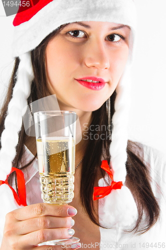 Image of Young woman in red hat waiting for the new year