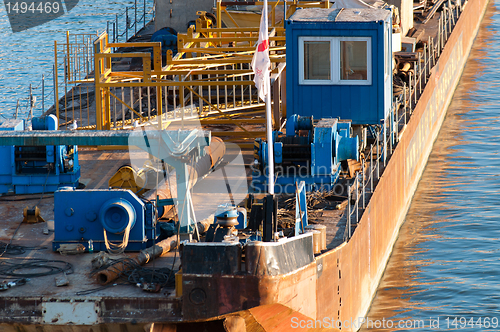 Image of An industrial boat traveling on the ocean