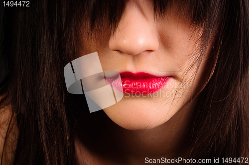 Image of Lips of an attractive girl with her hair hiding her eyes