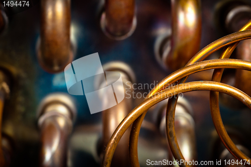 Image of Orange pipes and hoses with blurry background