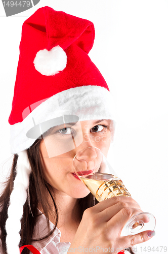 Image of Girl drinking champagne in Christmas custome