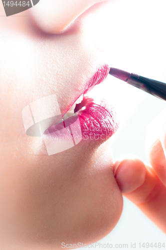 Image of Closeup detail of a model getting makeup