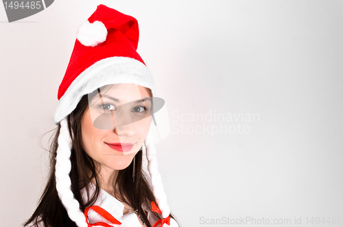 Image of Young woman in red hat waiting for the new year