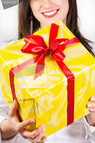 Image of Girl giving present to you