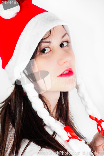 Image of Girl in Santa's hat against white background