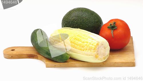 Image of Vegetables on a wooden plate