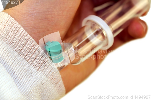 Image of hand with infusion needle