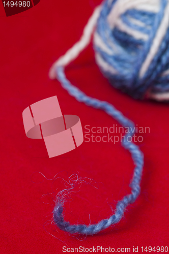 Image of Ball of yarn and knitting skewers
