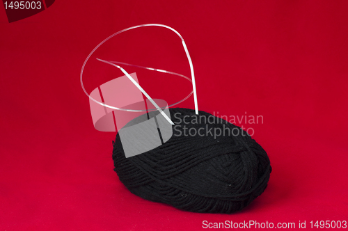 Image of Ball of yarn and knitting skewers