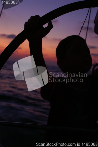 Image of a child  silhouette on a yacht
