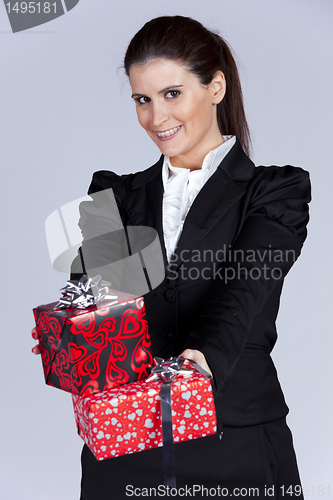 Image of Businesswoman with many gift packages