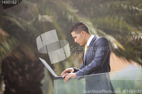 Image of Modern businessman at the office balcony