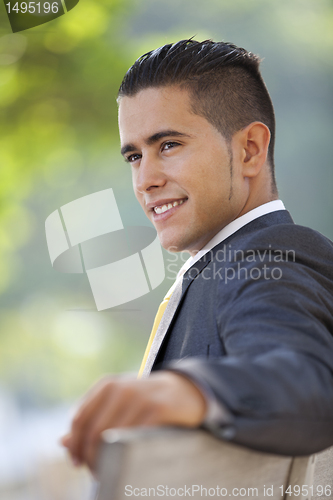 Image of Businessman sit in the bench park