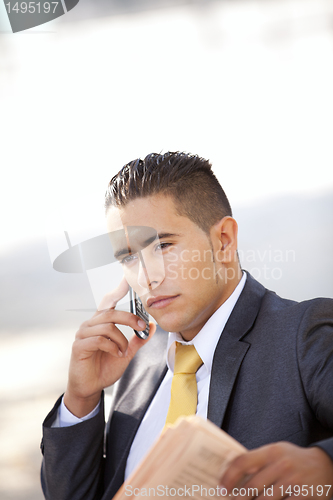 Image of Businessman working at the park