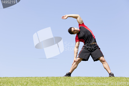 Image of Athlete warming and stretching