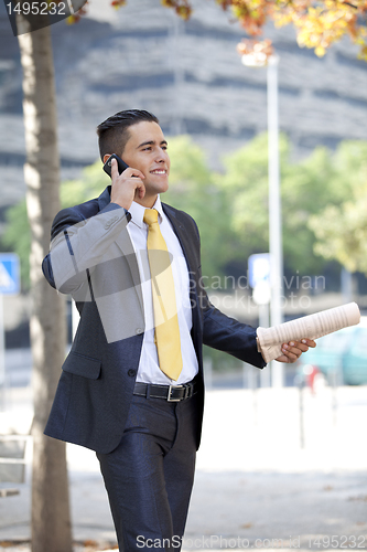 Image of Businessman walking at the city park